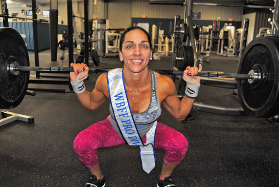 Amanda Crates-Bayliff shows her weightlifting form at Iron Fit Gym