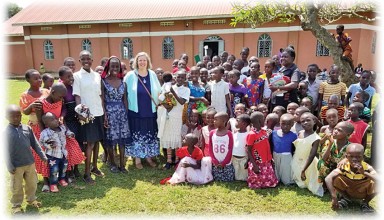 Katrina Forseth poses with children in Uganda