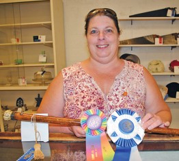 Roni Worden brought home the Best of Show winner at the 2018 antique show of the Hardin County Fair. The walking stick she brought has a long history with her husband's family, she said. Starting in 1683, members of the family carved their names in the wooden walker in England. The tradition continued when the walking stick came to America. It features a silver tip and handle, but also generations of Wordens. 