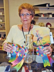 Sandy Dickson of Kenton brought home three winners from the antique show Wednesday with her entries of antique keys, a milk bottle and a hand fan. 
