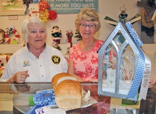 Linda Gibson (left) of Dunkirk earned a grand championship title with her yeast bread entry in the arts and crafts show at the Hardin County Fair. Dorothy Baum of Kenton took home a reserve championship with her snow scene lantern. 