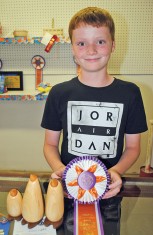 The judge was impressed with Gabriel Elsasser's woodworking skills and named his penguin family the grand champions of the youth division. 