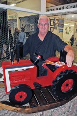 The grand championship in the professional woodworking portion of the fine arts show was awarded to Bob Titus of West Mansfield for his rocking tractor creation. 

Times photo/Dan Robinson