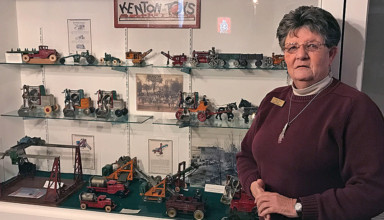 Museum director Linda Iams at the Kenton Toys display