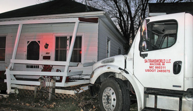 Truck hits homes