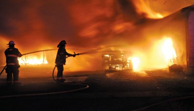 Firefighters battle the blaze at 279 E. Hale St., Ridgeway on Monday night.