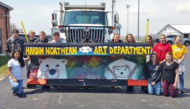 Hardin Northern art students display their painted snowplow.