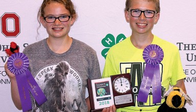 Mariann and Carl Woodruff display awards received during 4-H Natural Resources Day at Ohio State Fair
